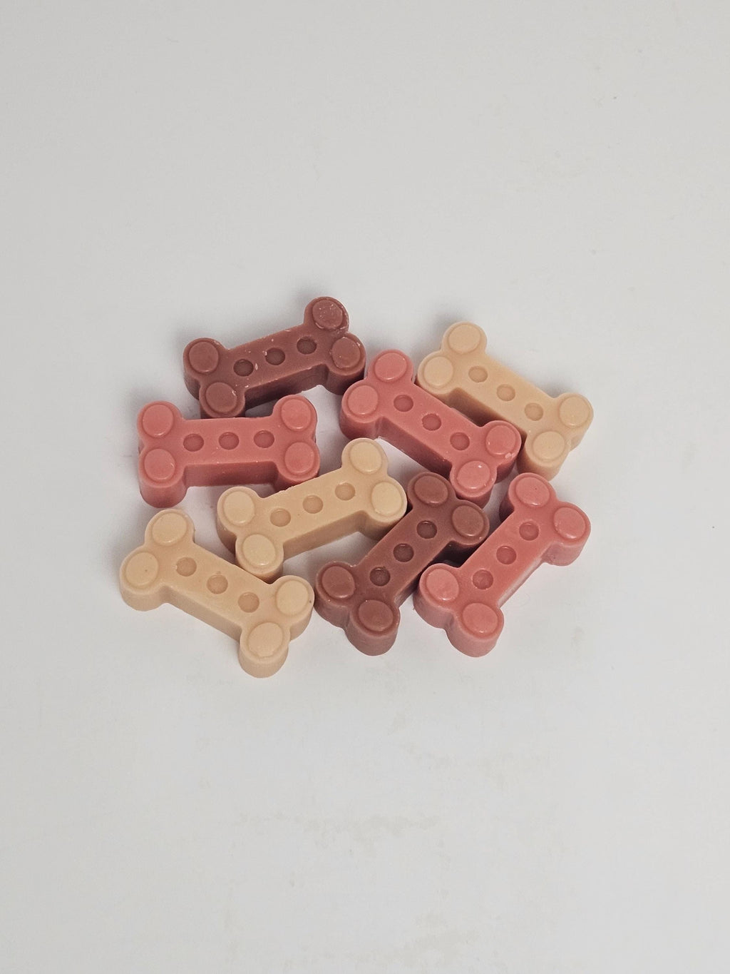 Bone Wax melts realistically colored and shaped as dog treats.